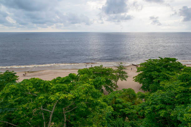 The coast of the Democratic Republic of Conga at the Atlantic Ocean. This is at the beach of Muanda, right at the mouth of Congo River, where the river joins the Ocean.