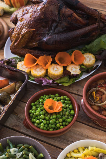 istock Thanksgiving dining, roast turkey with side dishes on table 1187003578
