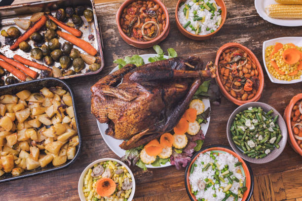 istock Thanksgiving dining, roast turkey with side dishes on table 1187003733