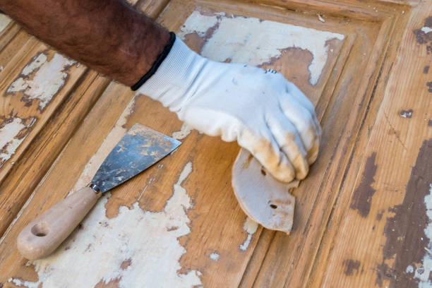 istock Carpenter work the wood with the sandpaper 1187004376