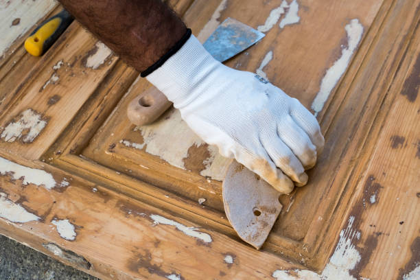 istock Carpenter work the wood with the sandpaper 1187004391
