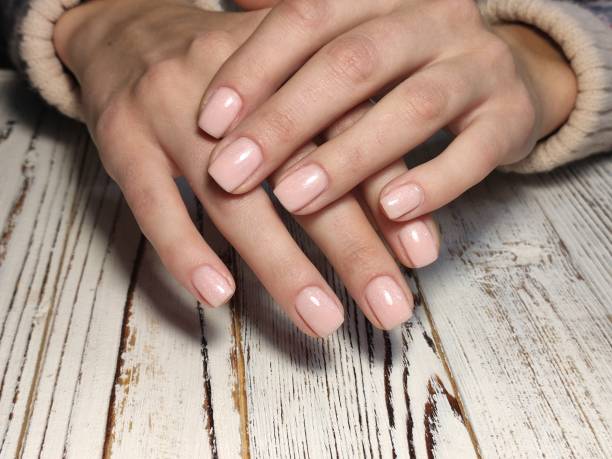 istock sexy pink manicure on long beautiful nails 1187004601