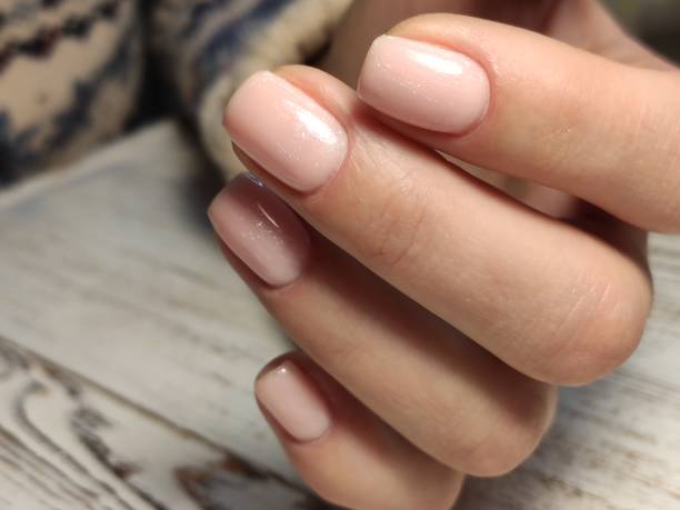 istock fashionable beige manicure with a silver design 1187005649