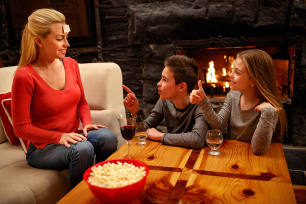 istock Family time- Mother playing game with children 1187005821