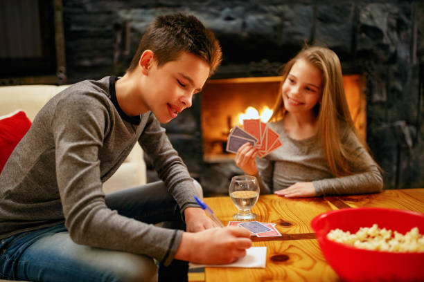 istock Kids playing card game at home 1187006782