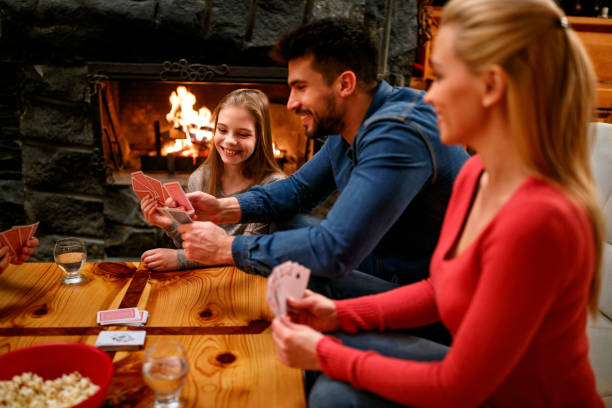 istock parents playing cards with kids 1187006836