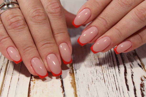 istock beautiful red French manicure 1187007202