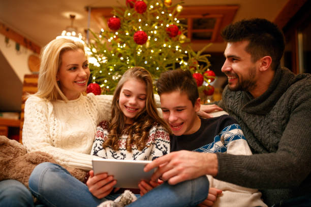 istock family time on Christmas at home with digital tablet 1187008983