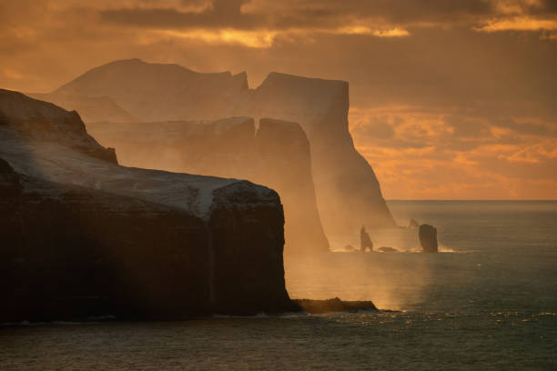 Streymoy and Eysturoy Streymoy and Eysturoy cliffs in sunset light, Faroe Islands eysturoy stock pictures, royalty-free photos & images