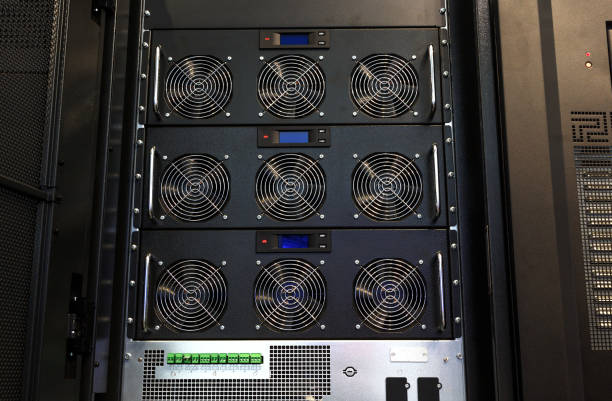 istock Row of bitcoin miners set up on the wired shelfs. Computer for Bitcoin mining. cables plug to motherboard for mining machine. Cryptocurrency computer with many peripheral slots. 1187010808