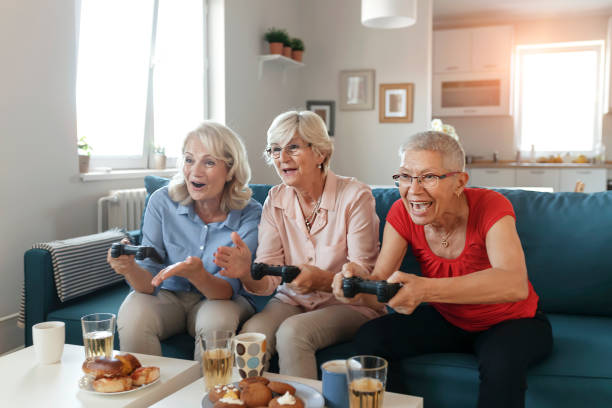 istock Senior Female Friends Playing Video Game 1187011980