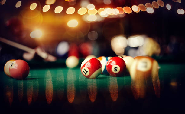 istock Colorful billiard balls on a green billiard table. 1187015339