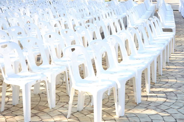 istock Outdoor Lots of white plastic chairs 1187015894