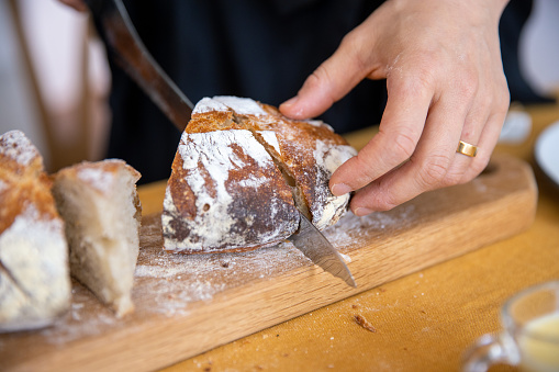 Close-up of cutting bread