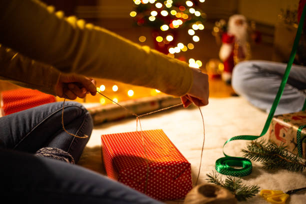 istock Final touches of wrapping Christmas presents 1187017546