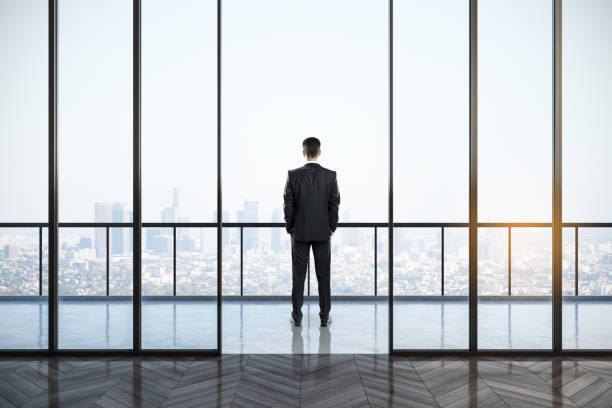 istock Businessman in clean office interior 1187017652