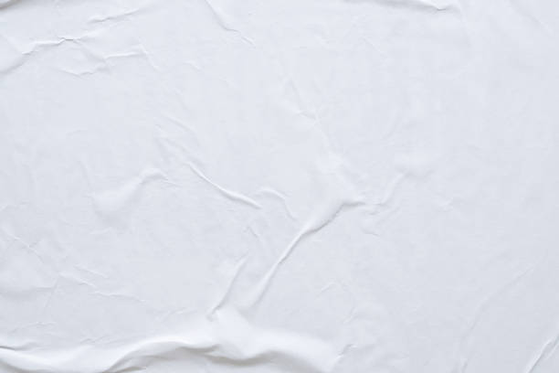 istock Blank white crumpled and creased paper poster texture background 1187019664