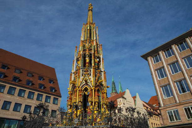 A view of the stunning Schoner Brunnen, known as the Beautiful Fountain in English, located in the city of Nuremberg in Germany.