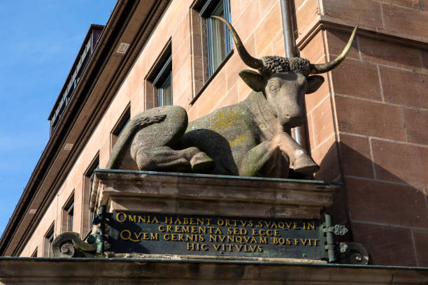 Nuremberg, Germany - October 25th 2019: A stone Ox on the Fleischbrucke, or Butchers Bridge, symbolising Franconian stoic composure, in the city of Nuremberg in Germany.