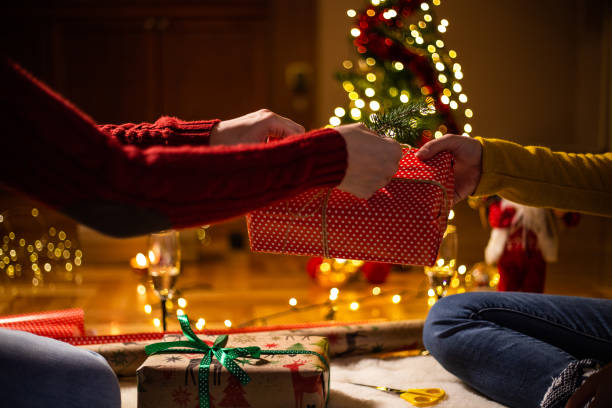 istock Decorating Christmas present with a pine cone spruce branch 1187030542