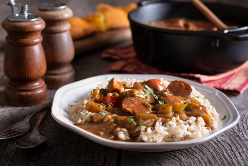 Sausage Gumbo Over Rice on Rustic Wood Table