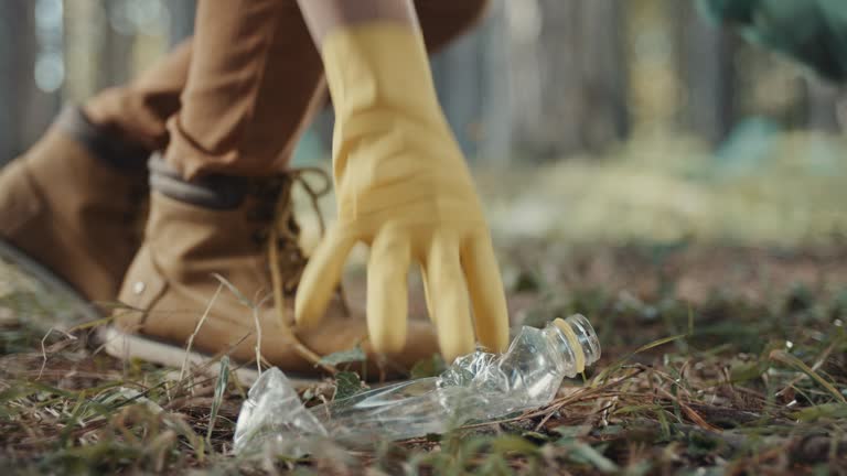 Picking up plastic bottle