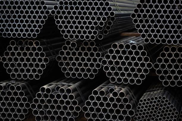 istock Black steel pipe bundles at the construction site 1187042525