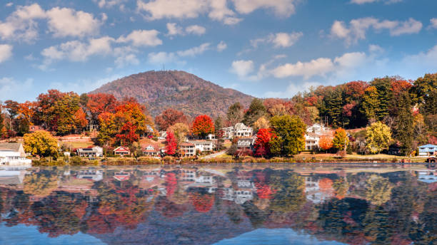 Fall Landscape showing Lake houses with reflections in Lake Junaluska stock photo