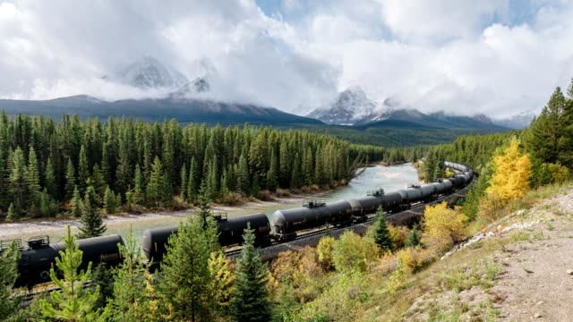 Canadian freight train passing through on Morant's curve in Banff national park