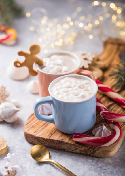 istock Hot chocolate cacao drinks with marshmallows in Christmas mugs on grey background. Traditional hot beverage, festive cocktail at X-mas or New Year 1187060445