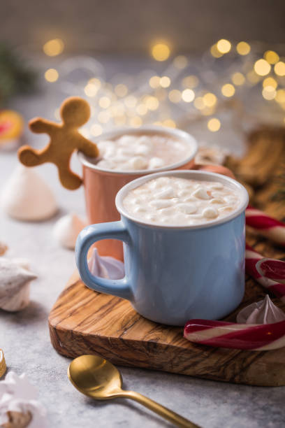 istock Hot chocolate cacao drinks with marshmallows in Christmas mugs on grey background. Traditional hot beverage, festive cocktail at X-mas or New Year 1187060447