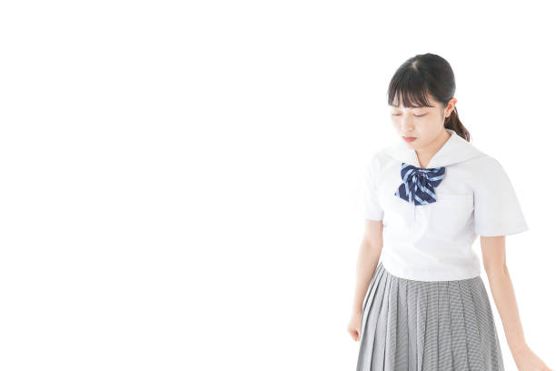 istock Schoolgirl with smile wearing uniform 1187060611