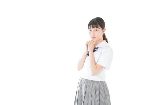 istock Schoolgirl with smile wearing uniform 1187060625