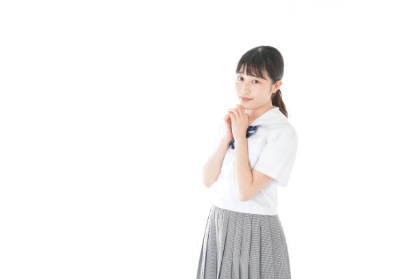 istock Schoolgirl with smile wearing uniform 1187060626