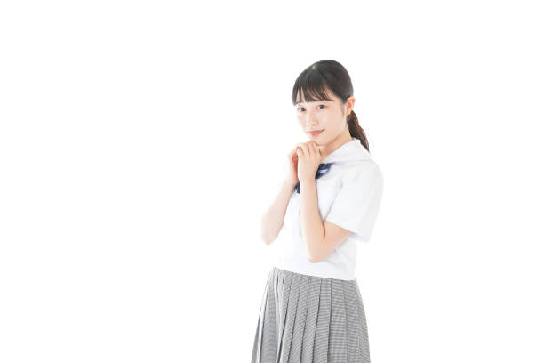 istock Schoolgirl with smile wearing uniform 1187060629
