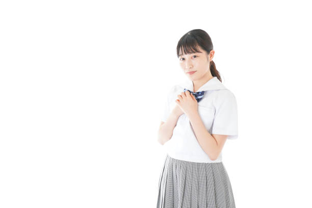 istock Schoolgirl with smile wearing uniform 1187060636