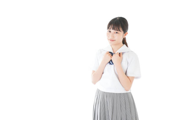 istock Schoolgirl with smile wearing uniform 1187060640