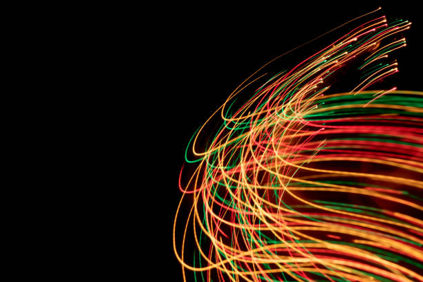 istock Glowing light trails - LED light painting (multi colored) 1187061985