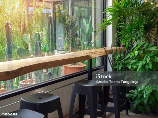 Live Edge Bar Table And Black Chairs In Cafe Stock Photo - Download Image Now - At The Edge Of, Table, Wood - Material