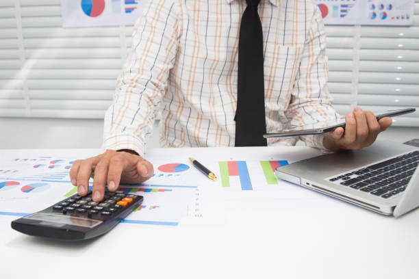 istock Businessmen are calculating and analyzing performance statistics for future investments. 1187066136