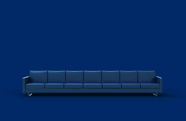 istock Extremely long blue leather sofa isolated on blue background. 3d rendering 1187067223