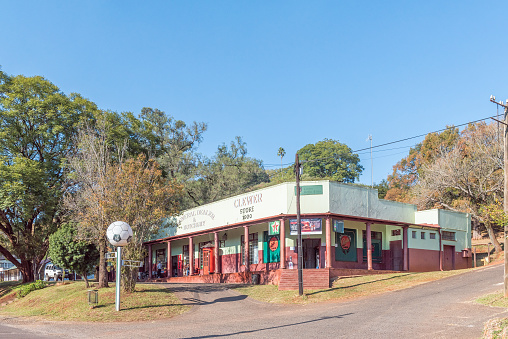Pilgrims Rest, South Africa - May 21, 2019: A street scene, with the historic Clewer Store building, in Pilgrims Rest in Mpumalanga. People are visible