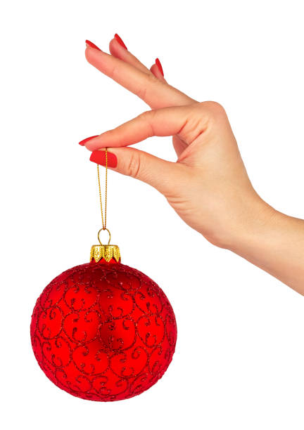 istock Christmas Red Ball in Female Hand 1187070906