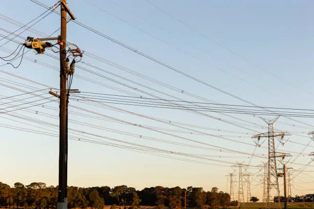 Photo of Power Line Connecting Interstate Power Pylons During Golden Hour