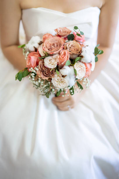 istock Asian bride with flower bouquet 1187074696