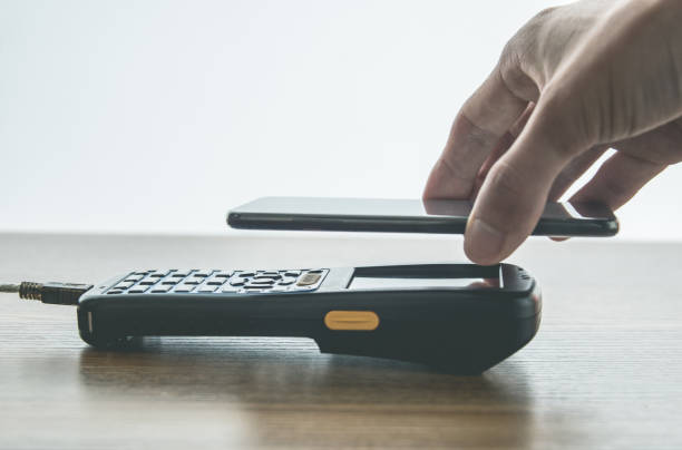 istock Close-up of mobile phone to pay 1187076009