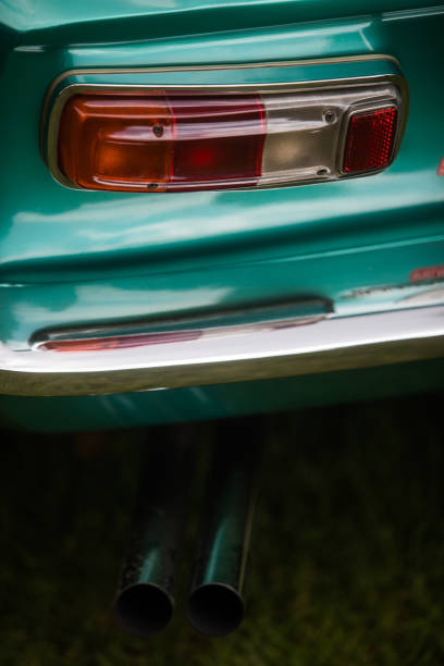 istock Red tail light and exhaust of a classical vintage car 1187078381