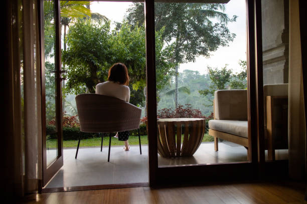 istock a young woman relaxing at a small coffee table 1187078739