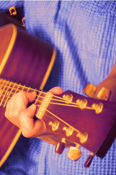 istock Man playing an acoustic guitar 1187080229