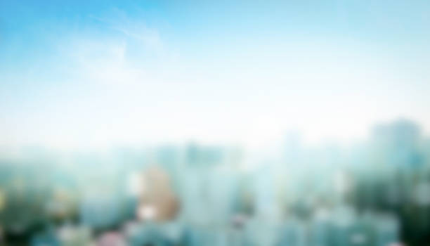 World Habitat Day concept: Blurred city and blue sky background stock photo